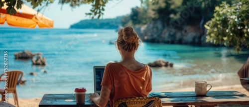 Digital nomad working on laptop at beach cafe, serene sea view in background, epitome of freedom.