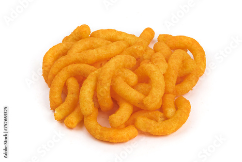 A pile of orange cheese corn puff snacks isolated on white