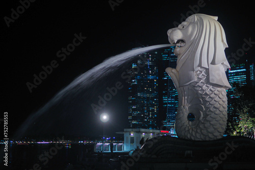Singapore, Singapore - April 19, 2018 : Singapore's signature, the Merlion, with a background of buildings.