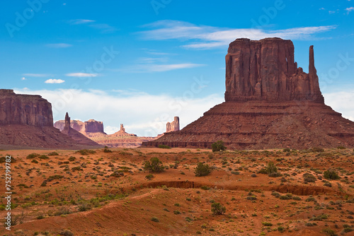 The Monument Valley in Utah–Arizona state with the crossing road in the desert - The valley is considered sacred by the Navajo Nation - USA - True color photography