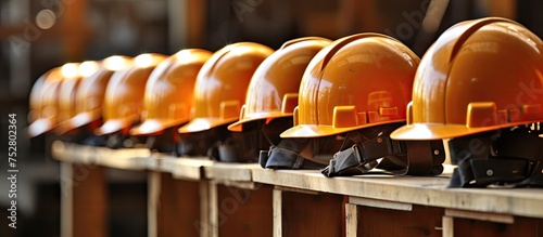 Diverse Array of Colorful Hard Hats Lined Up in a Construction Site in a Symmetrical Pattern