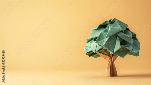 Arbol hecho con papel técnica origami sobre fondo naranja