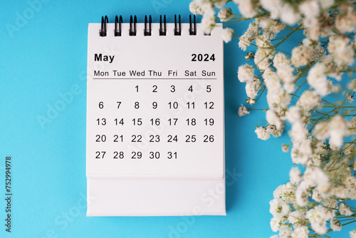 May 2024 calendar flat lay on blue background