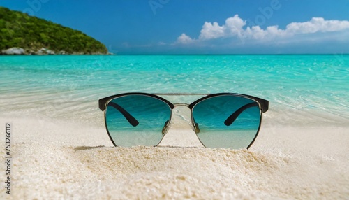 Sunglasses and tranquility on a sandy beach with turquoise water