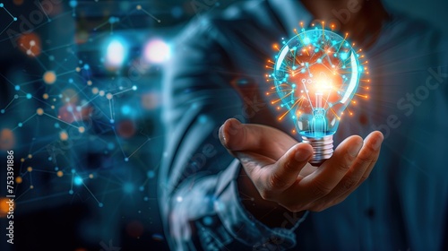 Business strategic planning ideas for investment and business growth Businessman uses his hand to support a glowing blue light bulb with futuristic graphic technology icons.