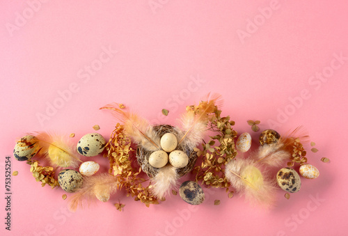 Easter composition with quail eggs, feathers, and dried flowers.