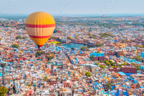 Hot air balloon flying over Mehrangarh Fort with Blue City - Jodhpur , india 