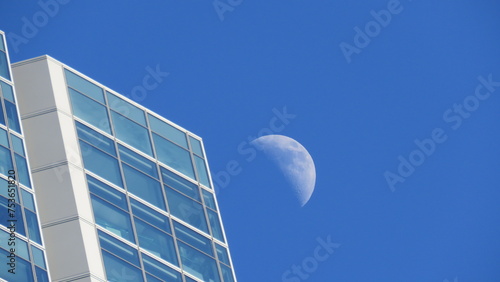 moon on blue background buildings modern architecture skyscraper madrid