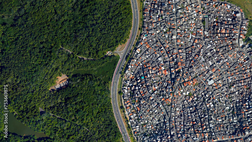 Forest and city border and road, forest and city separated by an s-shaped line, looking down aerial view from above – Bird’s eye view forest and city border Salvador, Bahia, Brazil