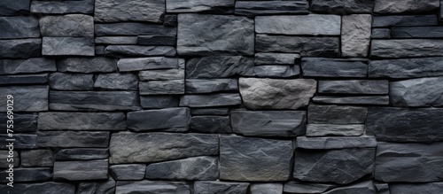 Background of stone blocks on a black wall