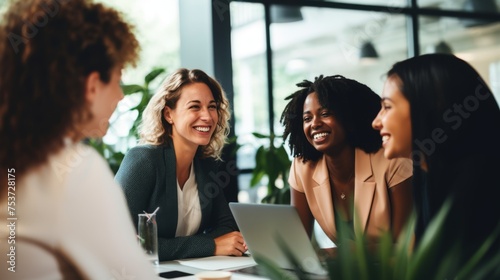 A group of diverse, confident, women working together, smiling, in an office, business environment