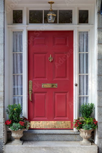 A bold red front door is inviting, vibrant and a beacon of classic elegance. 
