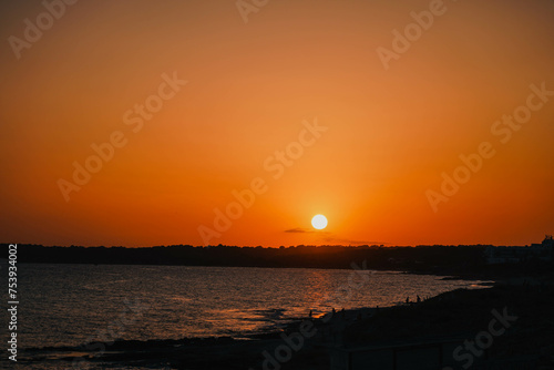 Magic orange sunset view. A sunset is a natural phenomenon that occurs daily as the sun dips below the horizon, marking the end of daylight hours. It is a breathtaking and often picturesque event 