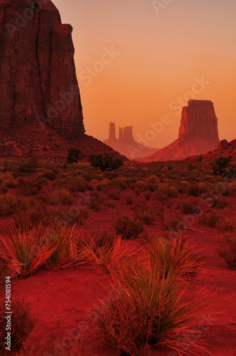Twilight view of the North Window and Elephant Butte, towards East Mitten Butte and other spires and towers of Monument Valley Navajo Tribal Park, Arizona, Southwest USA.