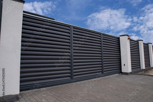 Automatic sliding metal gate with shutters