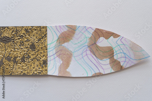 two paper shapes, one square and one lancet with grungy patterns