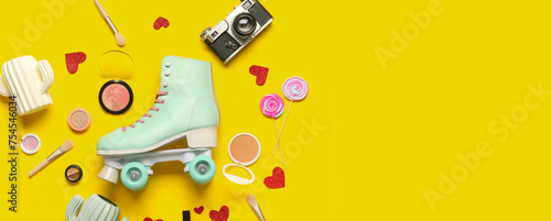 Composition with vintage roller skate, photo camera and cosmetic products on yellow background