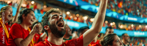 Spanish football soccer fans in a stadium supporting the national team, La Selección, La Furia Roja 