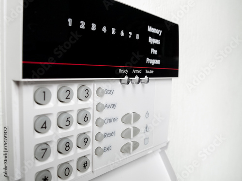 alarm control panel on the light wall of the room, Isolated