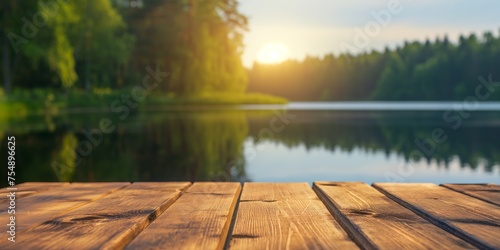 Sun-drenched wooden table with a serene, blurry lakeside and lush greenery background.