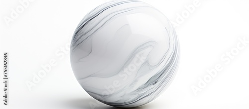 A white marble paperweight shaped like an egg rests on a sleek white surface, embodying elegance and simplicity in monochrome photography