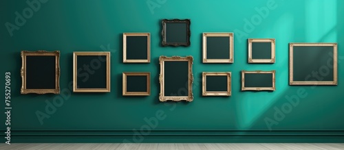 A wall covered in a collection of frames, ranging from antique to modern styles, displayed on a vibrant green background. The frames appear to be part of an art fair gallery or museum exhibition