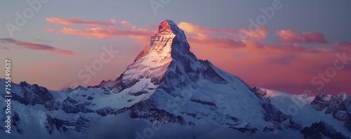 Mountain peak covered in snow at dawn, with space for copy.