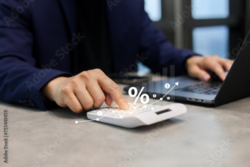 close up manager man hand press on calculator to calculate about commission rate form company's project after deal with client in office room for business lifestyle concept