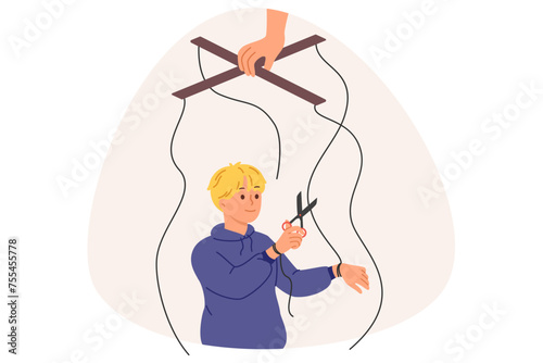 Independent boy frees himself from parental manipulation by cutting puppeteer ropes that interfere with self-development. Puppeteer hand is trying to control child and direct son in right direction
