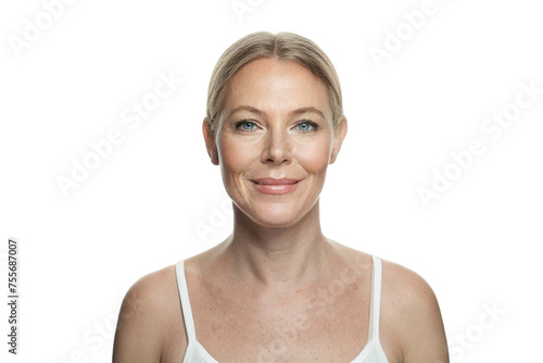Cheerful mid adult woman with healthy aging skin and natural makeup isolated on white background. Skincare, facial treatment and cosmetology concept