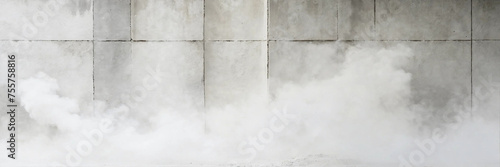 water flowing from the waterfall. Empty white abstract cement wall and smoke in the