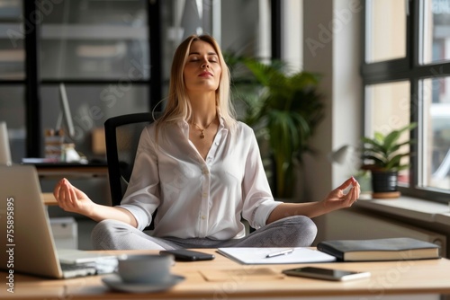 A moment of calm as a professional woman meditates at her desk, finding peace amid the busy workday.