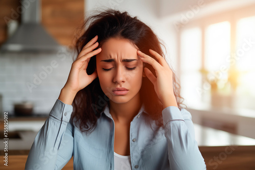 A pained expression indicating a severe headache or migraine.
