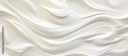 A close up of a silky white buttercream texture, resembling the pattern of soft linens. Made with dairy ingredients, perfect for desserts and cuisine