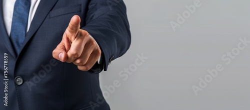 Businessman in suit pointing finger at you isolated on grey background with copy space area Generative AI