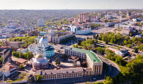 Scenic view from drone of historic center of old Russian town of Kursk with Znamensky Cathedral and Resurrection Church during restoration..