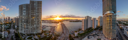 Sunset over causeway between two luxury apartment building on Miami Beach