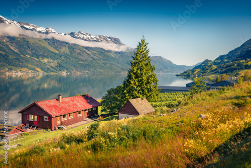 Exciting summer view of Lofthus village in Ullensvang municipality which is located in the Hardanger region of Hordaland county, Norway. Beauty of countryside concept background.