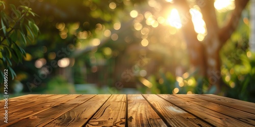 The empty wooden table with blur summer background