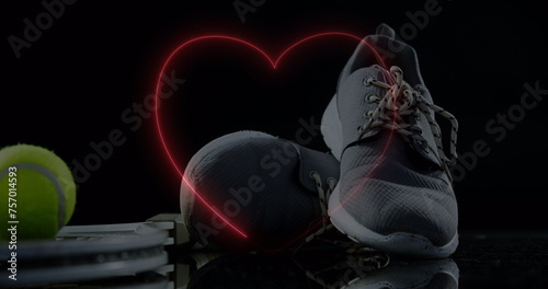 Image of neon hearts over ball and sport shoes