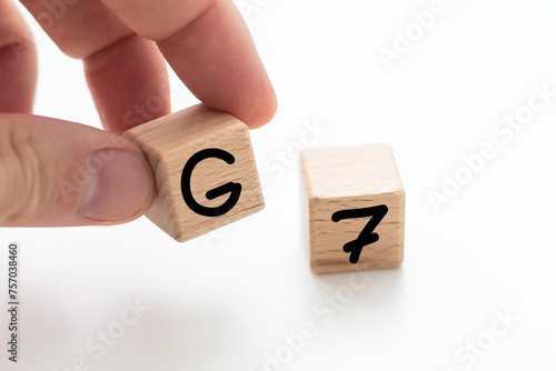 Human hand put wooden block and set technology word G7. Network future. High speed of mobile internet 