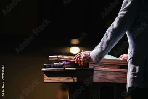 Pastor with hands on pulpit, Preacher Preaching