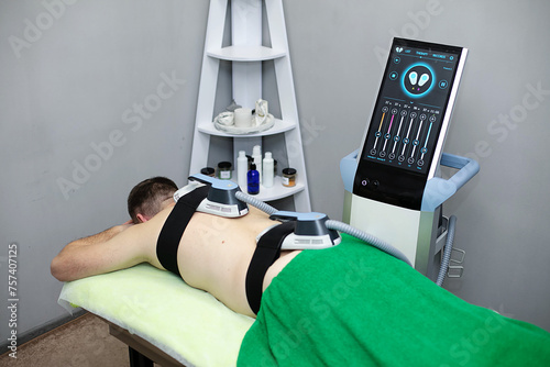 man undergo high-frequency magnetic therapy