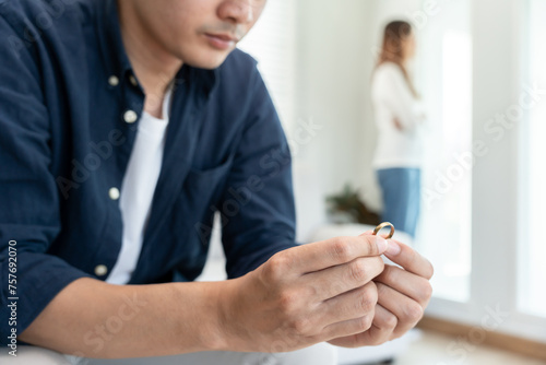 Divorce. Man remove married ring. Couples desperate and disappointed after marriage. Husband wife sad, upset and frustrated after quarrels conflict. distrust, love problems, betrayals, family, lover