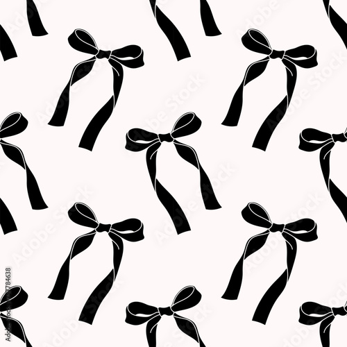 Cute coquette pattern seamless black ribbon bow. Cute feminine romantic background for textile, fabric, wallpaper, wrapping.