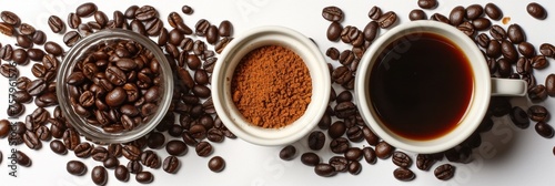 Close-up view of coffee, coffee beans and ground coffee powder on table.