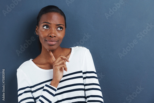 Thinking, doubt and black woman with mockup in studio for planning, questions or asking on blue background. Why, curious or African female model with emoji guess, problem solving or brainstorming
