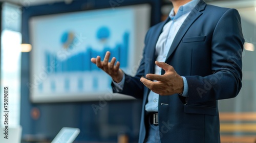 Close-up hand of Confident businessman delivering a presentation consulting training persuading employees client group, mentor leader explain graph strategy at team meeting workshop