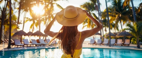 The woman in the straw hat and yellow dress stands near an outdoor swimming pool on the resort area where people can relax by taking photos or enjoying sunbathing Generative AI