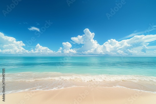 Bright sun over beach with turquoise water.